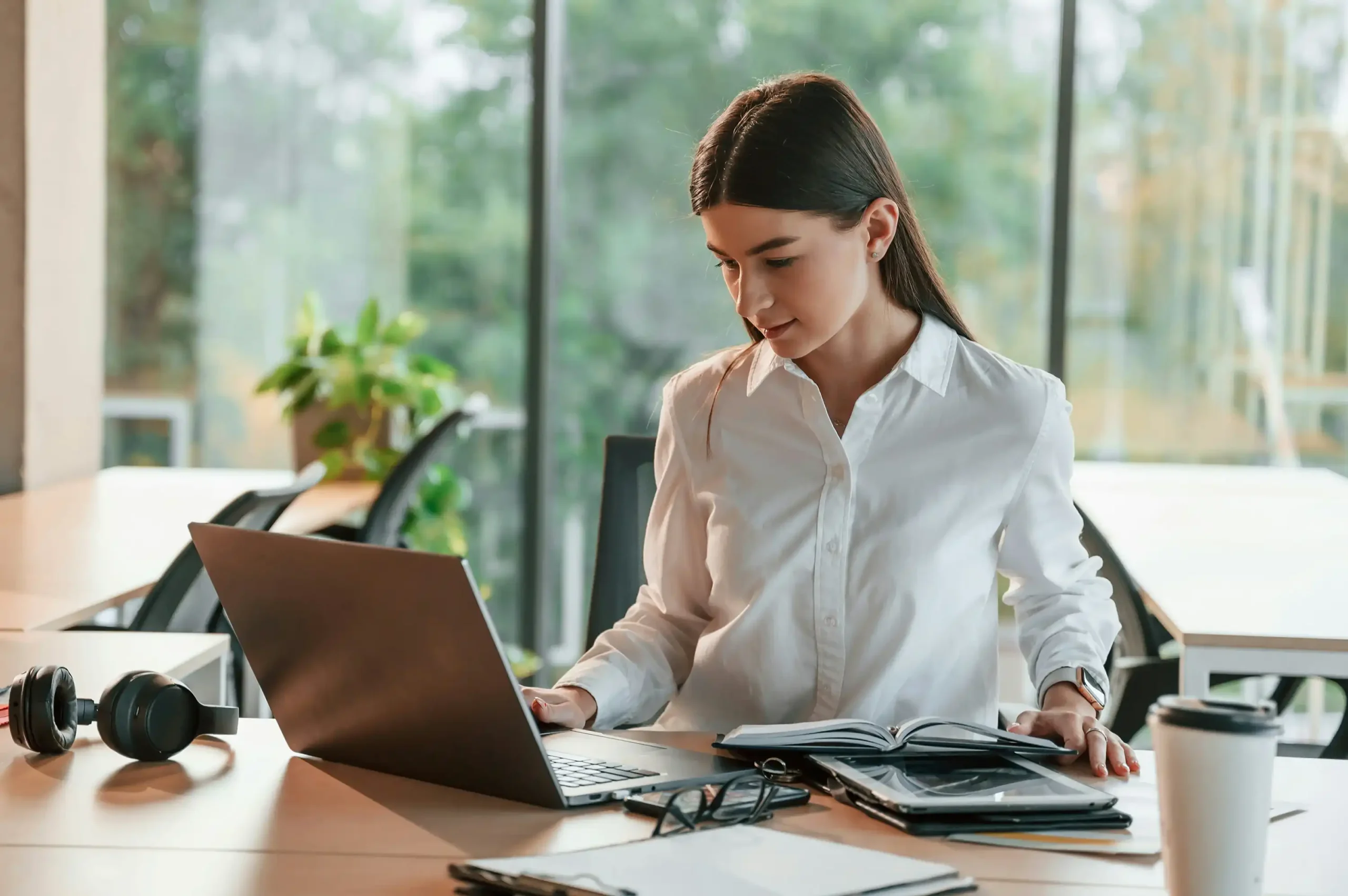 Woman Working On Laptop In Office - representing Client Rights and Protection